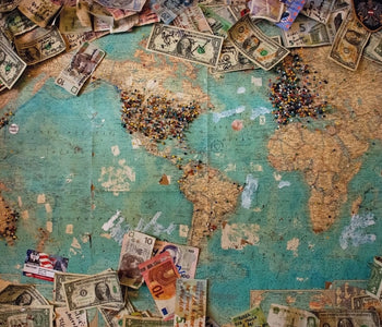 Vintage World Map, Dollar Bills With Notes and Push Pins Showing Where Visiting Travelers And Their Dollar Bills Came From -- a precursor of sorts to the modern-day niche hobby of currency tracking created by Where's George? (WheresGeorge.com)